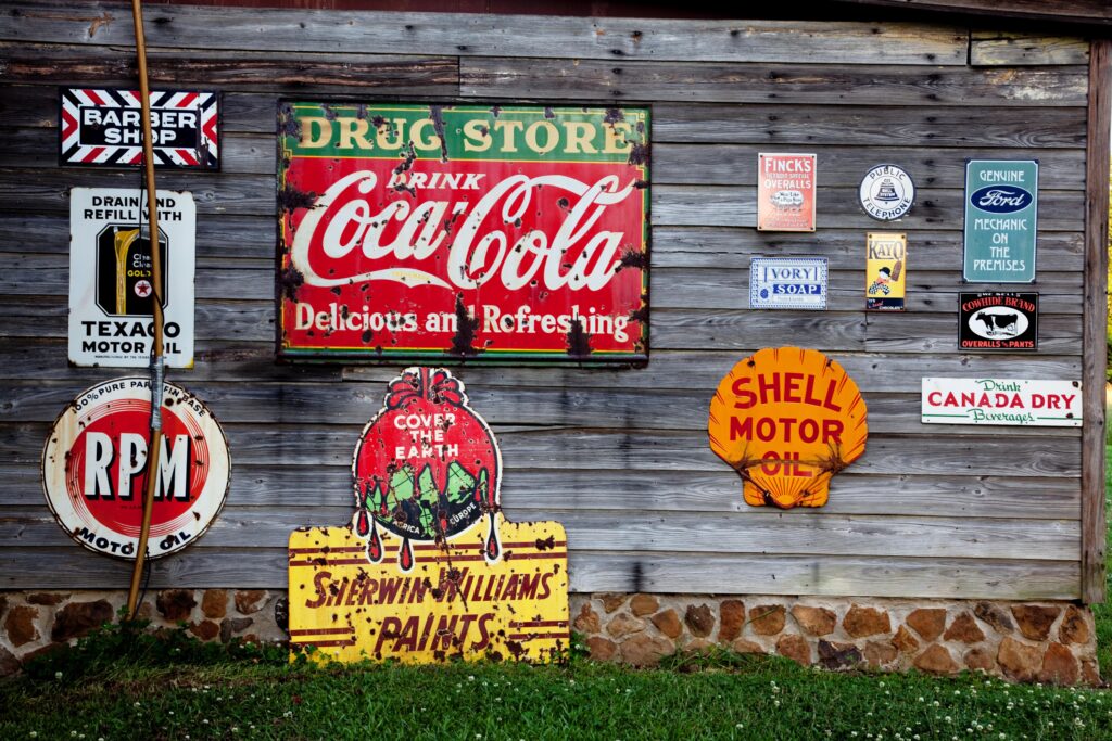 Drug store drink coca cola signage on gray wooden wall